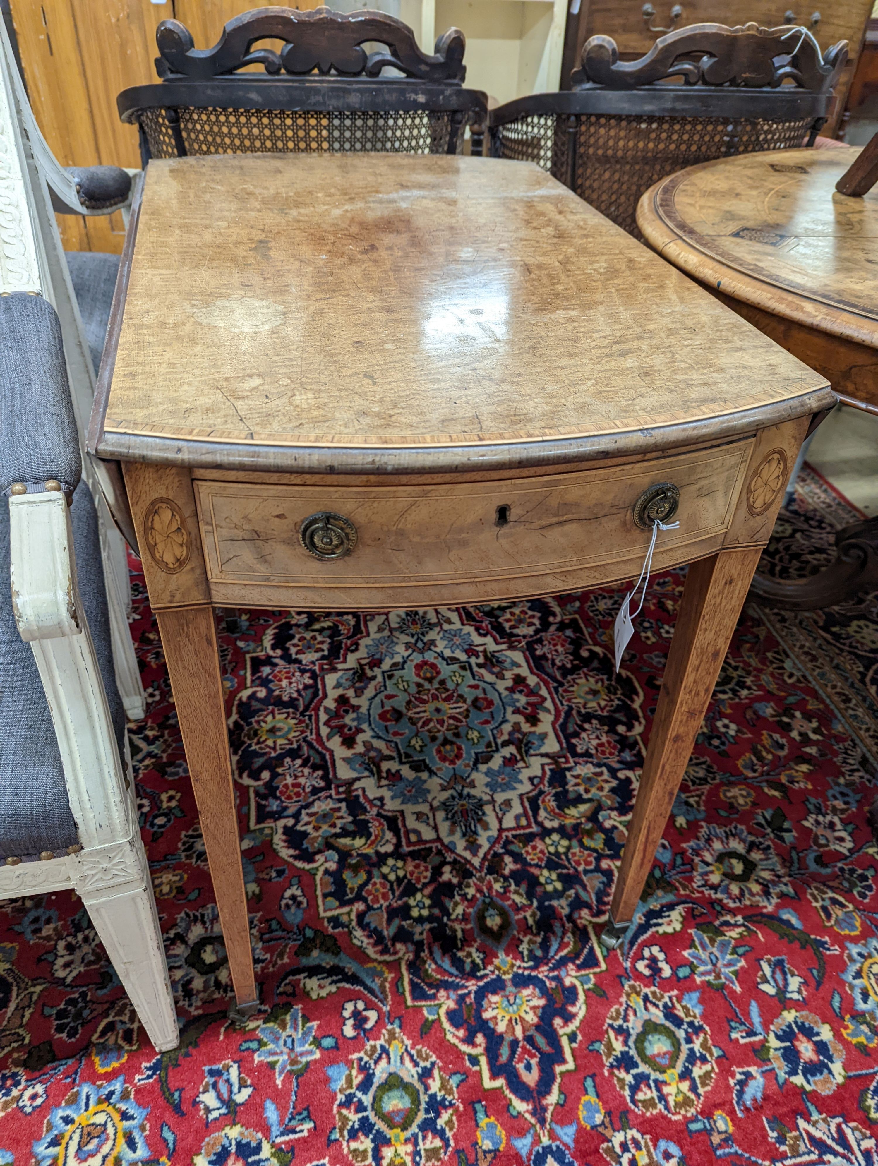 A George III satinwood banded mahogany oval topped Pembroke table, width 48cm, depth 70cm, height 71cm